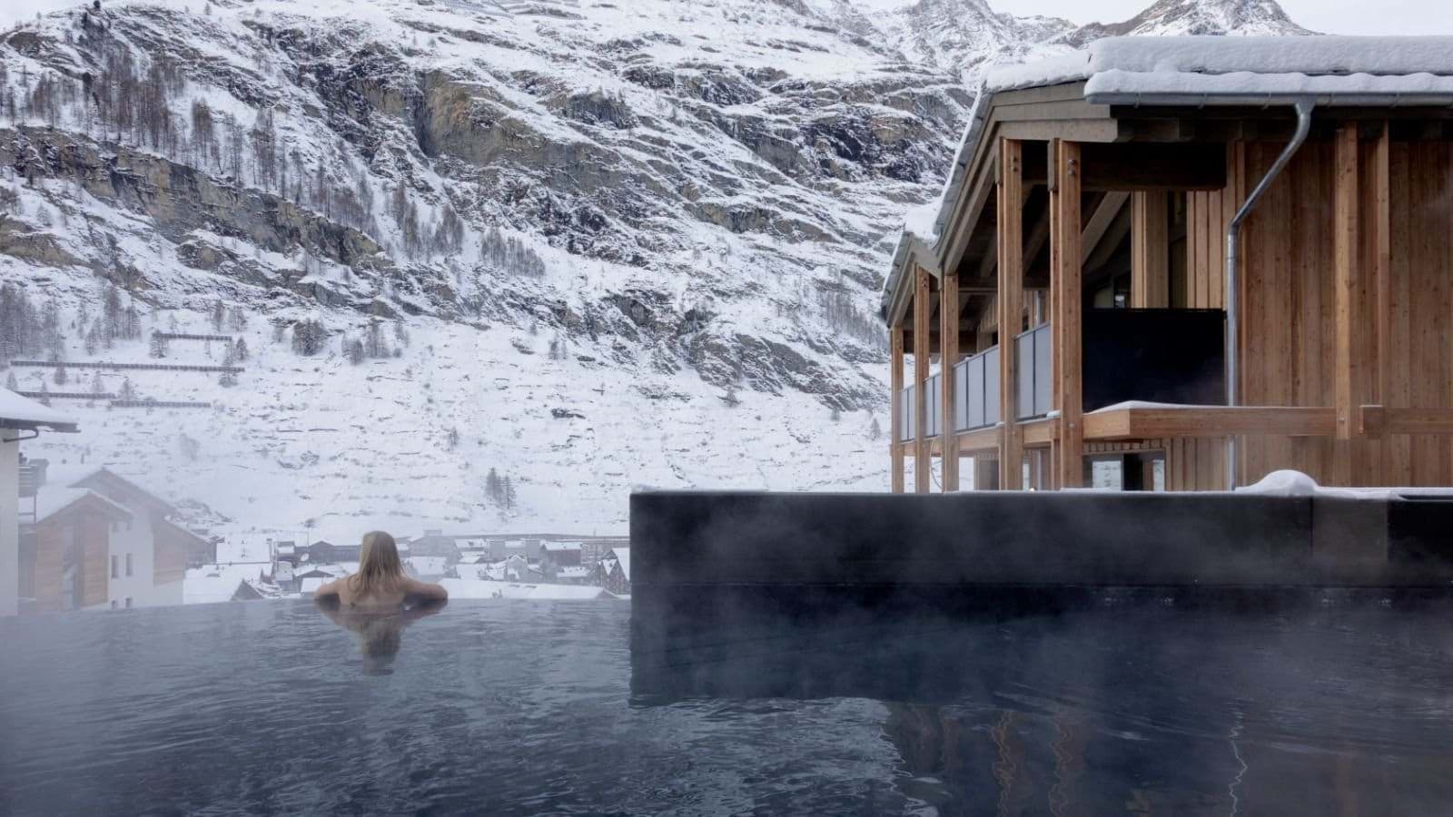Heated infinity pool with panoramic views of Zermatt mountains
