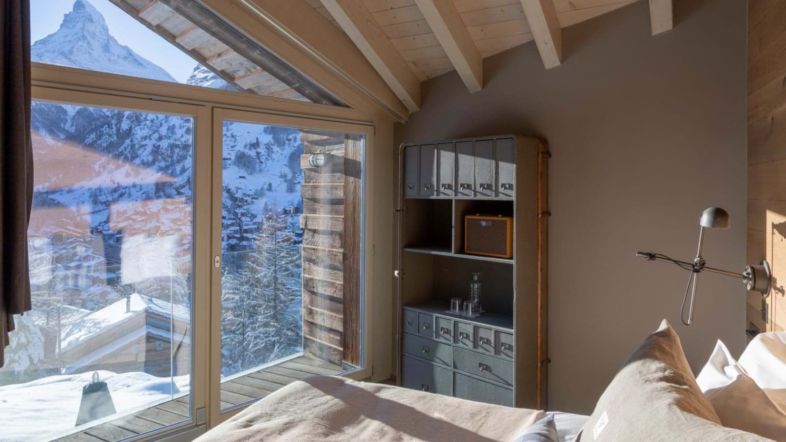 Bedroom featuring Matterhorn views and private balcony access