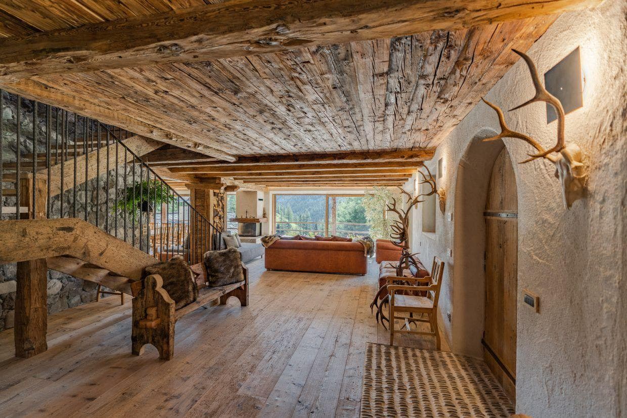 Great room with reclaimed timber ceiling and mountain views