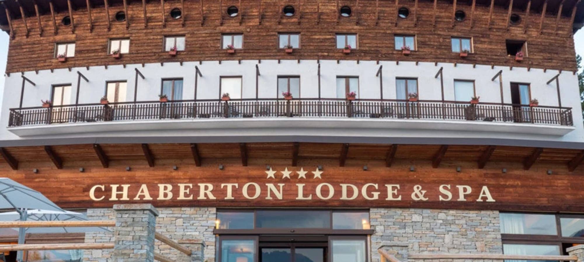 Lodge exterior featuring private balconies and 4-star spa facilities