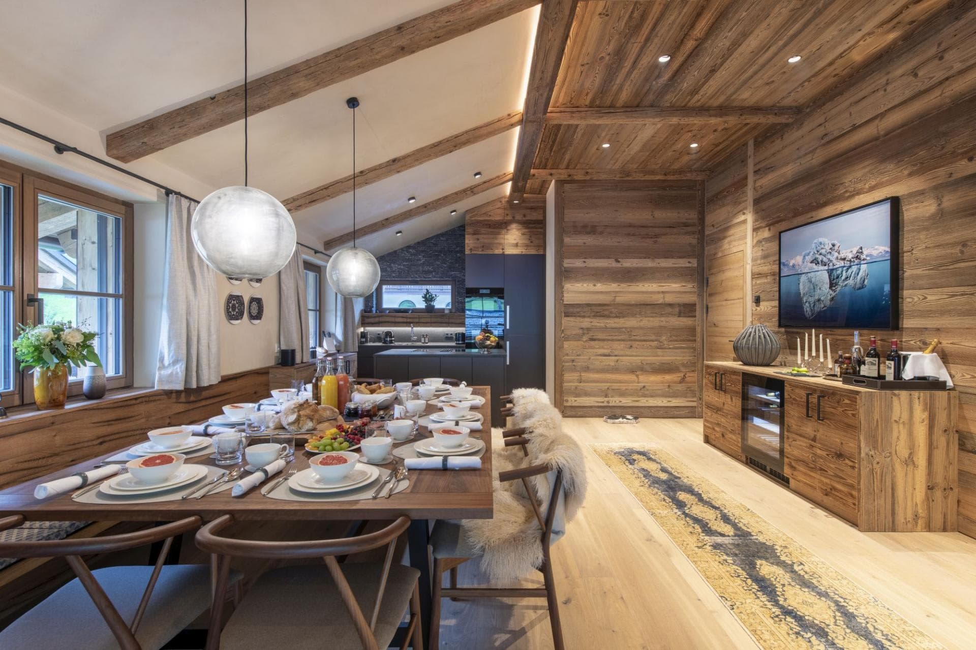 Dining area for 8 with wine fridge and reclaimed wood beams