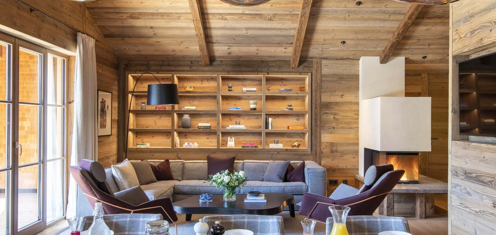 Living area with wood-burning fireplace and sectional seating for 8