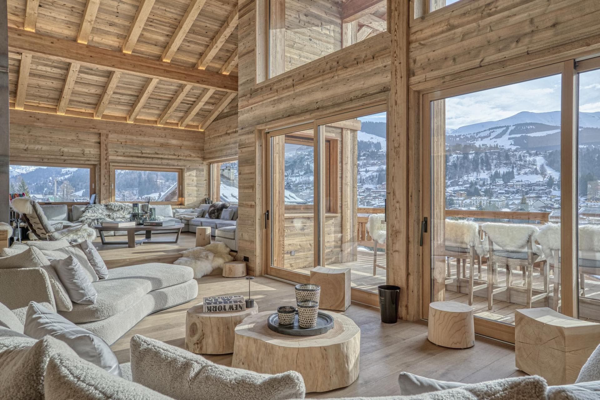 Open living area with vaulted timber ceilings and mountain valley views