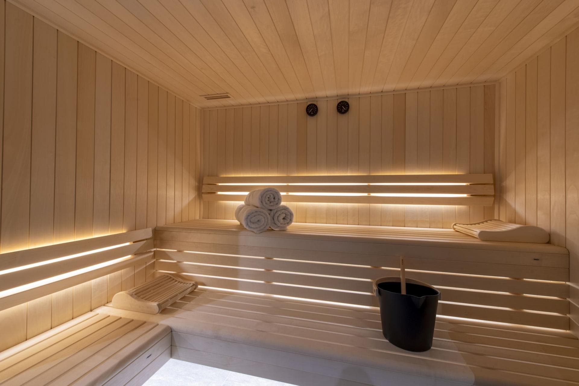 Private sauna with two-tier seating and integrated backlighting