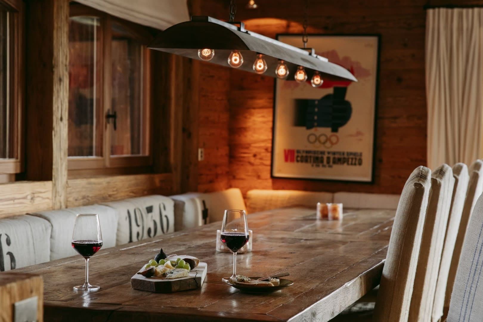 Dining area with reclaimed wood table and cushioned bench seating
