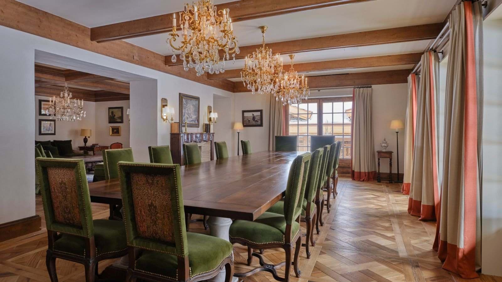 Dining room seats 14; crystal chandeliers and exposed wood beams