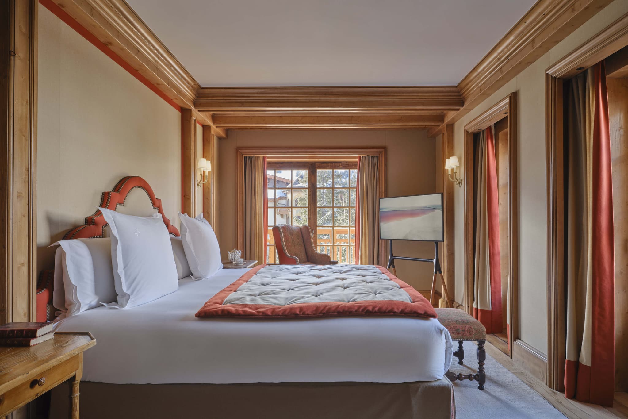 Primary bedroom with king bed and balcony access