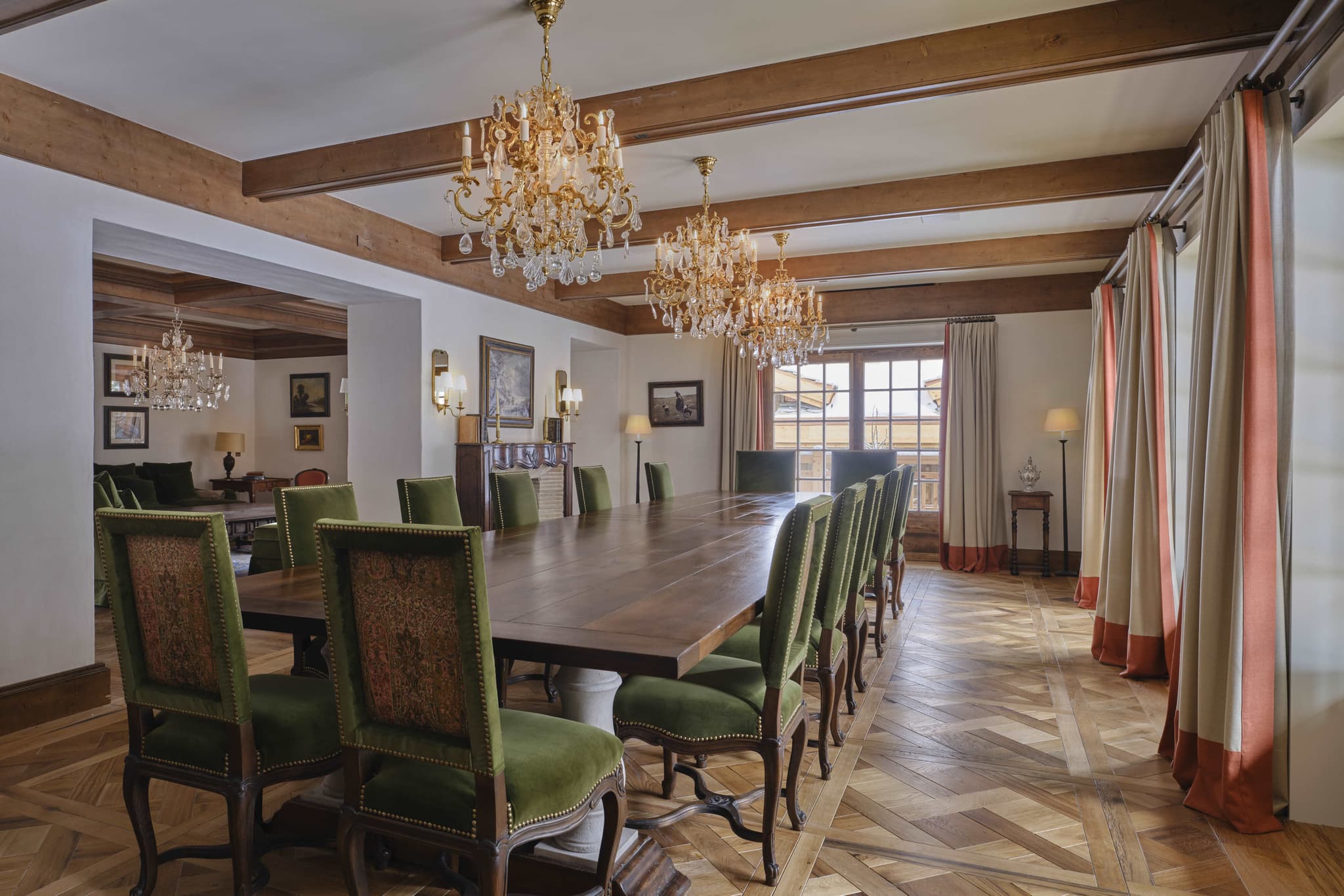 Dining room with parquet flooring and seating for 12 guests