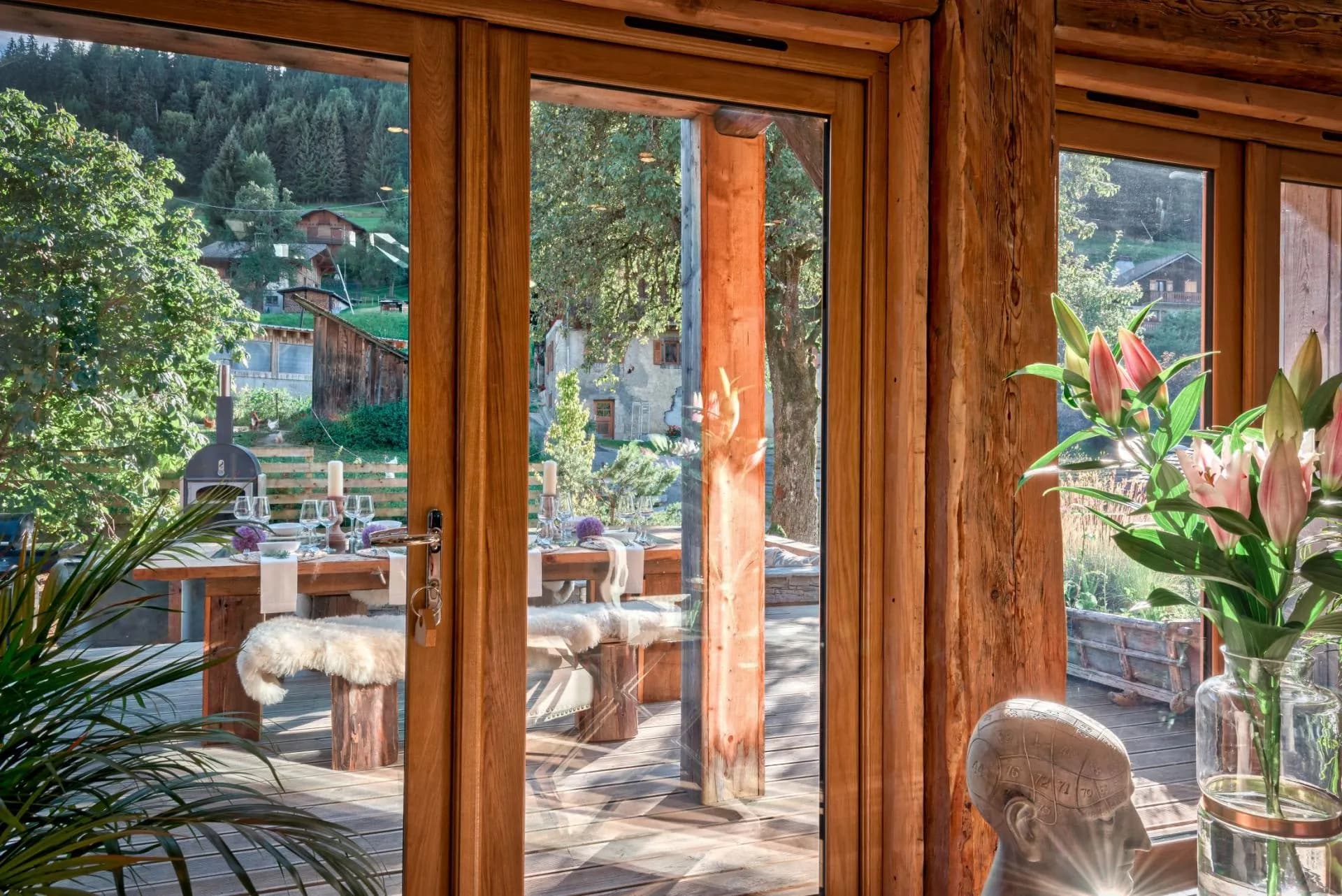 Outdoor terrace with wood-fired pizza oven and alfresco dining table