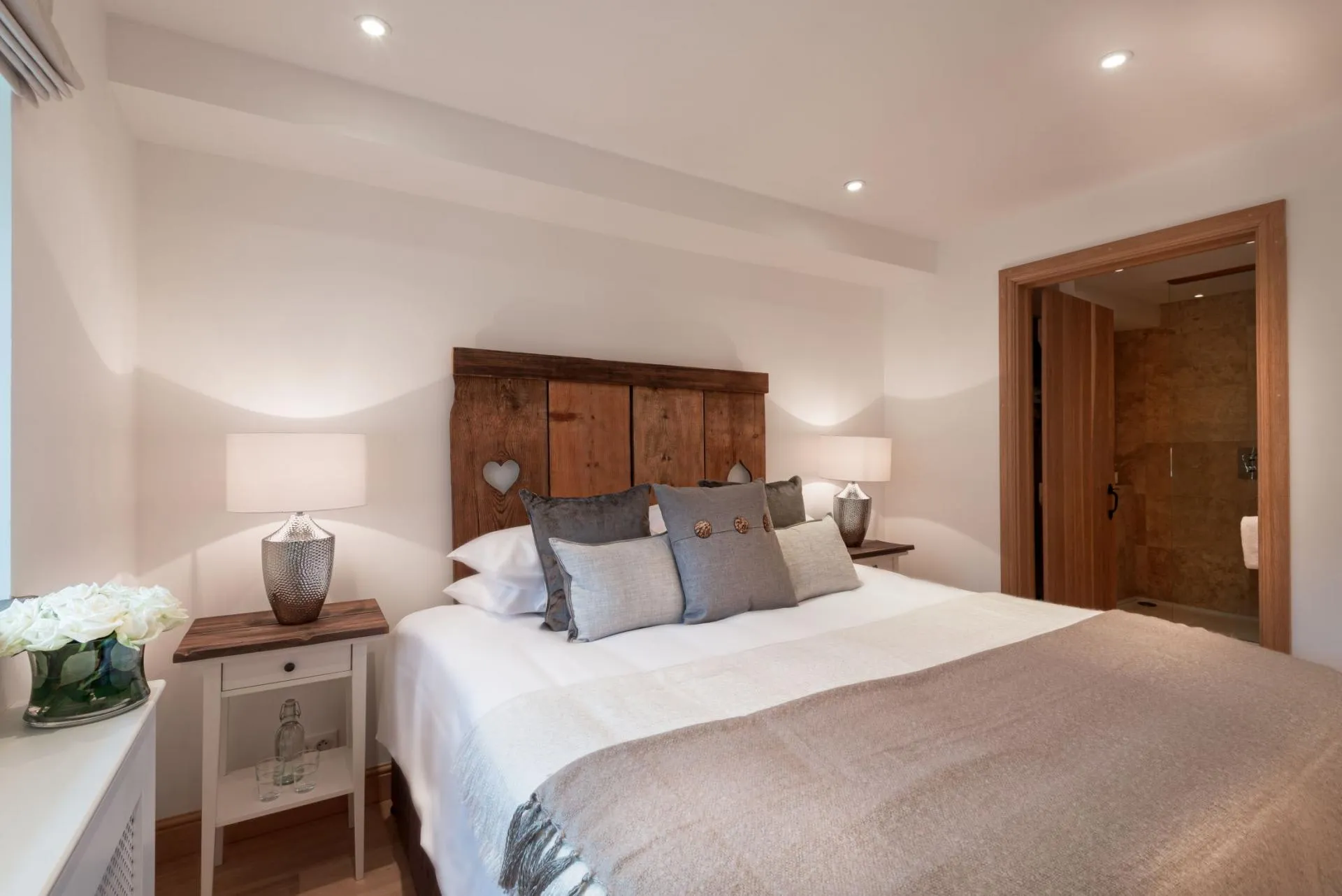 Guest bedroom with king bed and en-suite walk-in shower