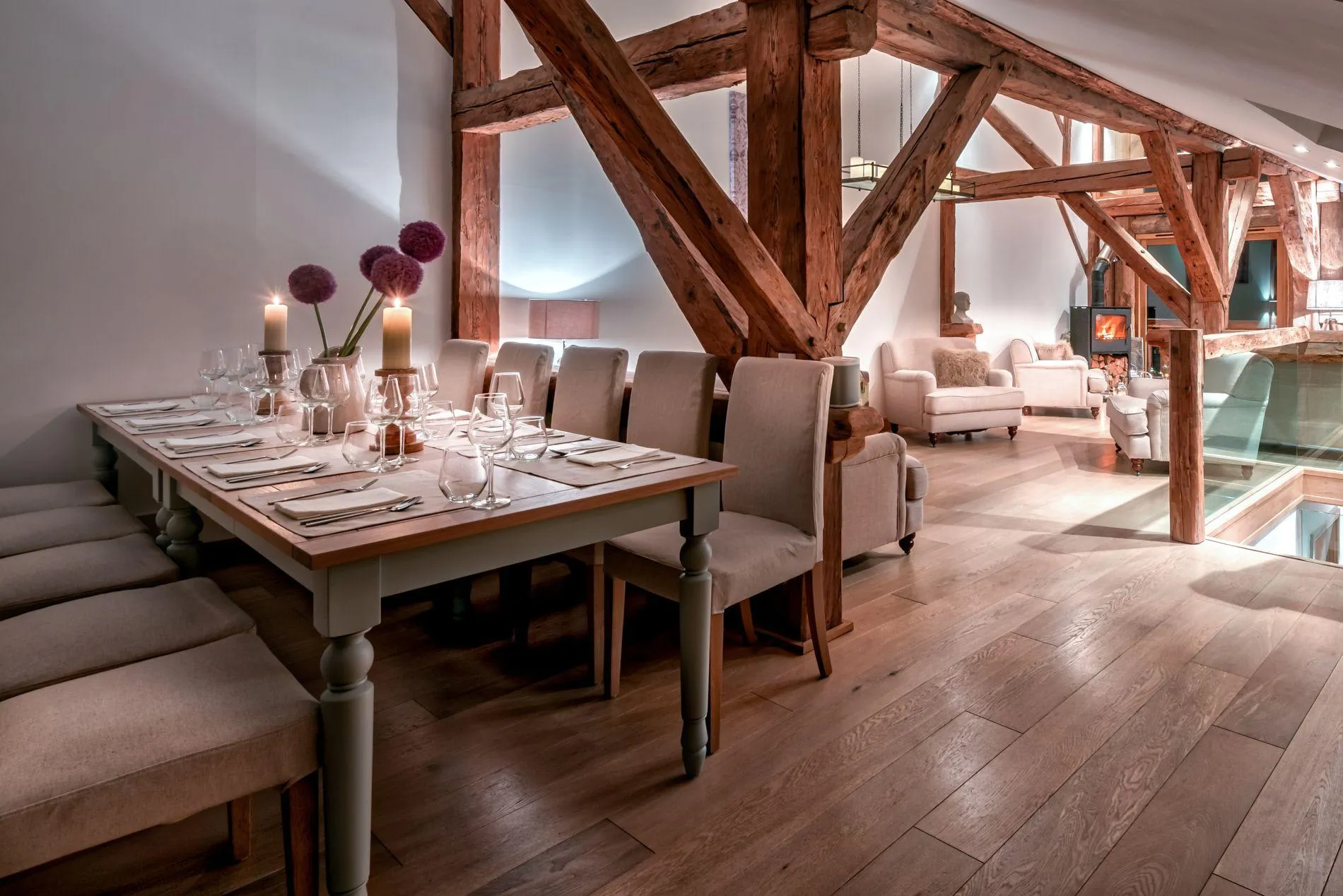 Dining area with seating for 10; original timber beams and wood-burning stove