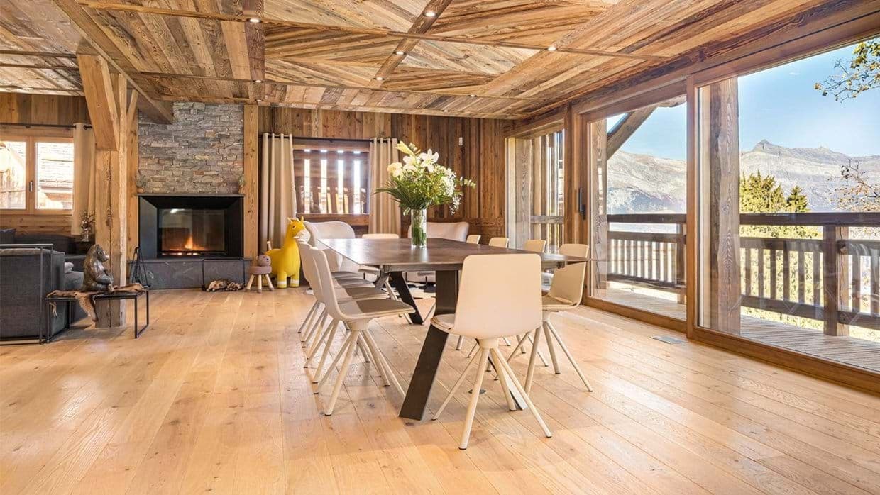 Dining area for 8 with wood fireplace and mountain valley views