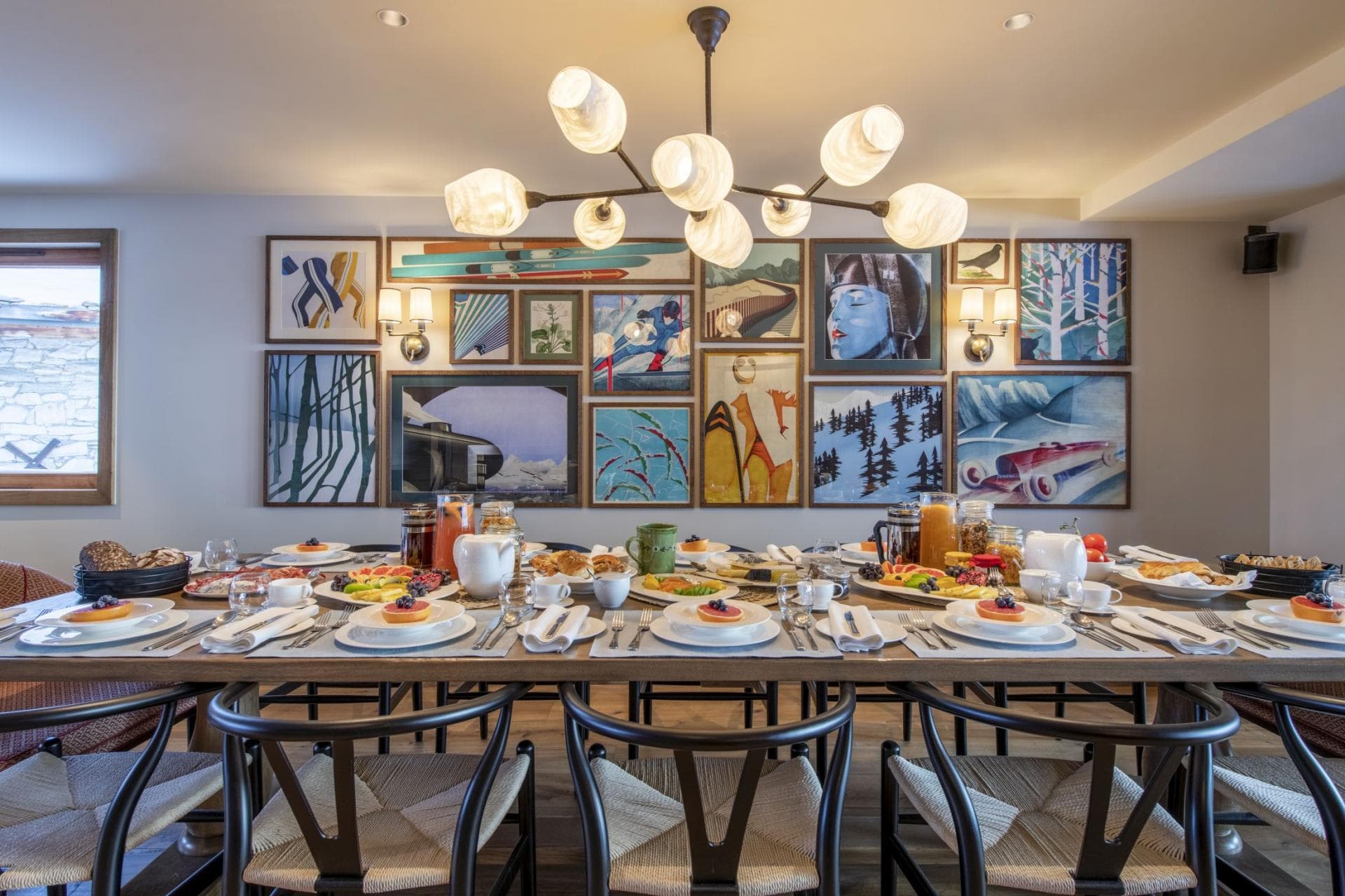 Dining table seats 10 with ski-themed gallery wall