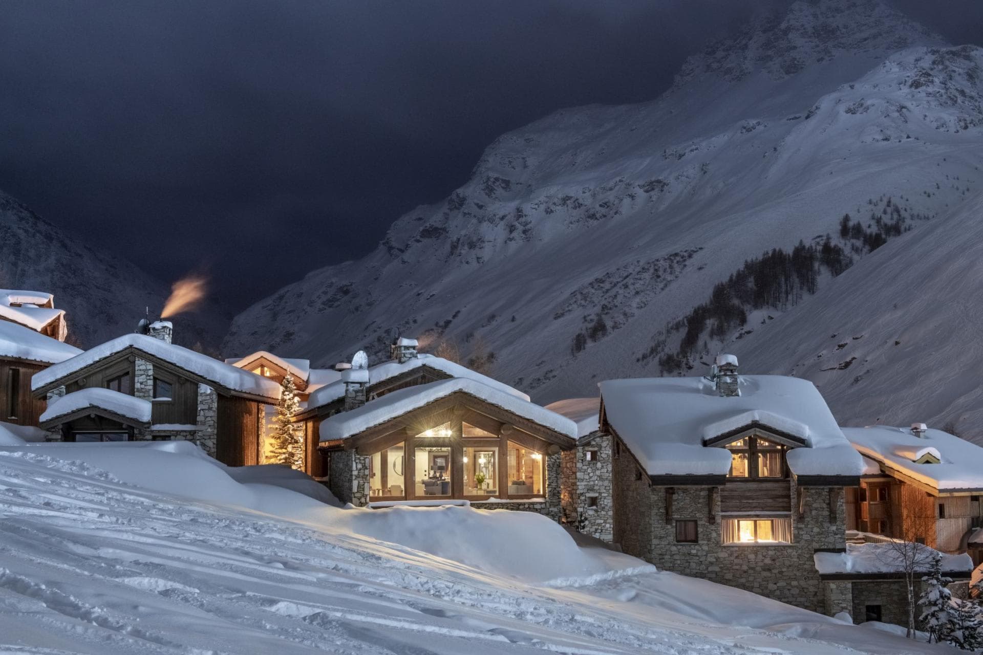 Mountain-side chalets with ski-in access and stone exteriors