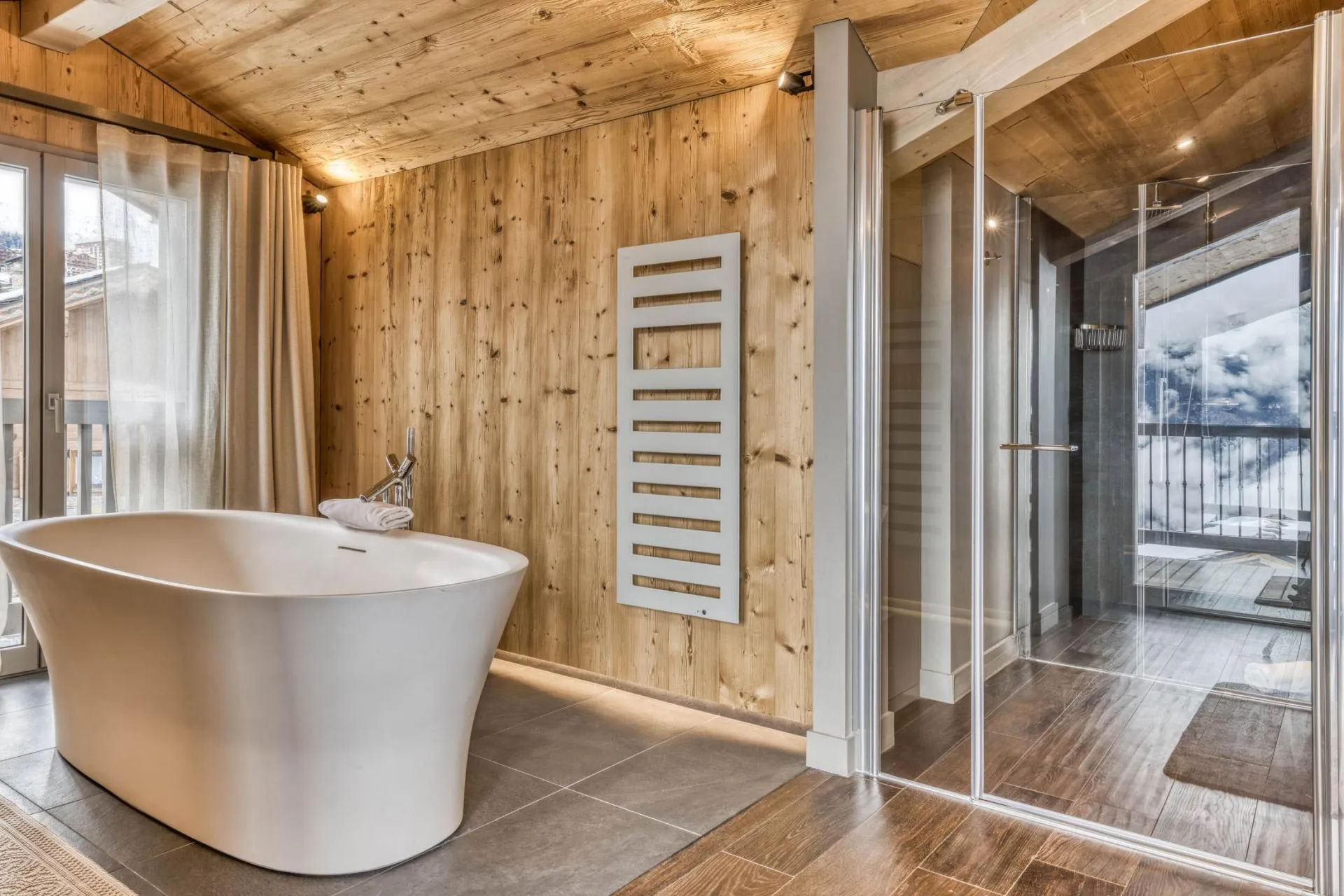 Bathroom with freestanding bath and separate shower