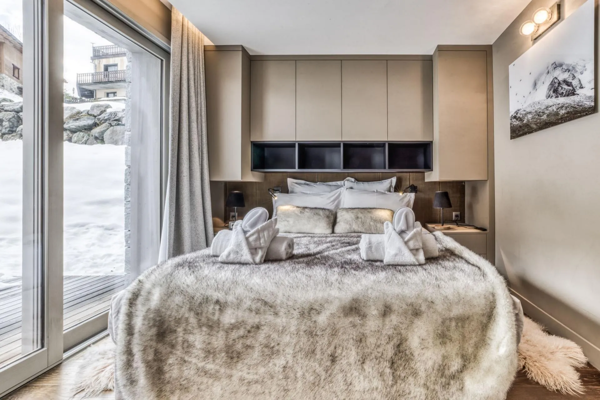 Double bedroom with glazed doors and built-in storage
