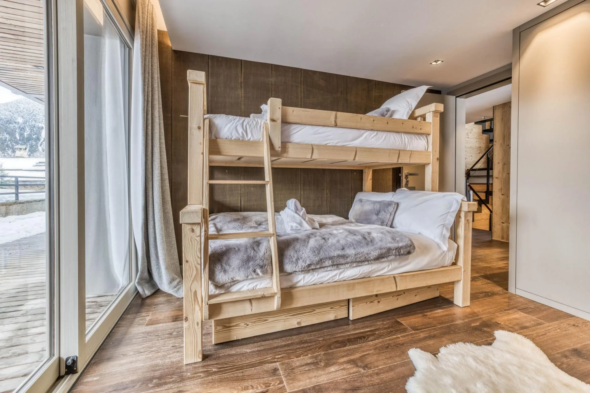 Children's room with bunk beds and glazed doors