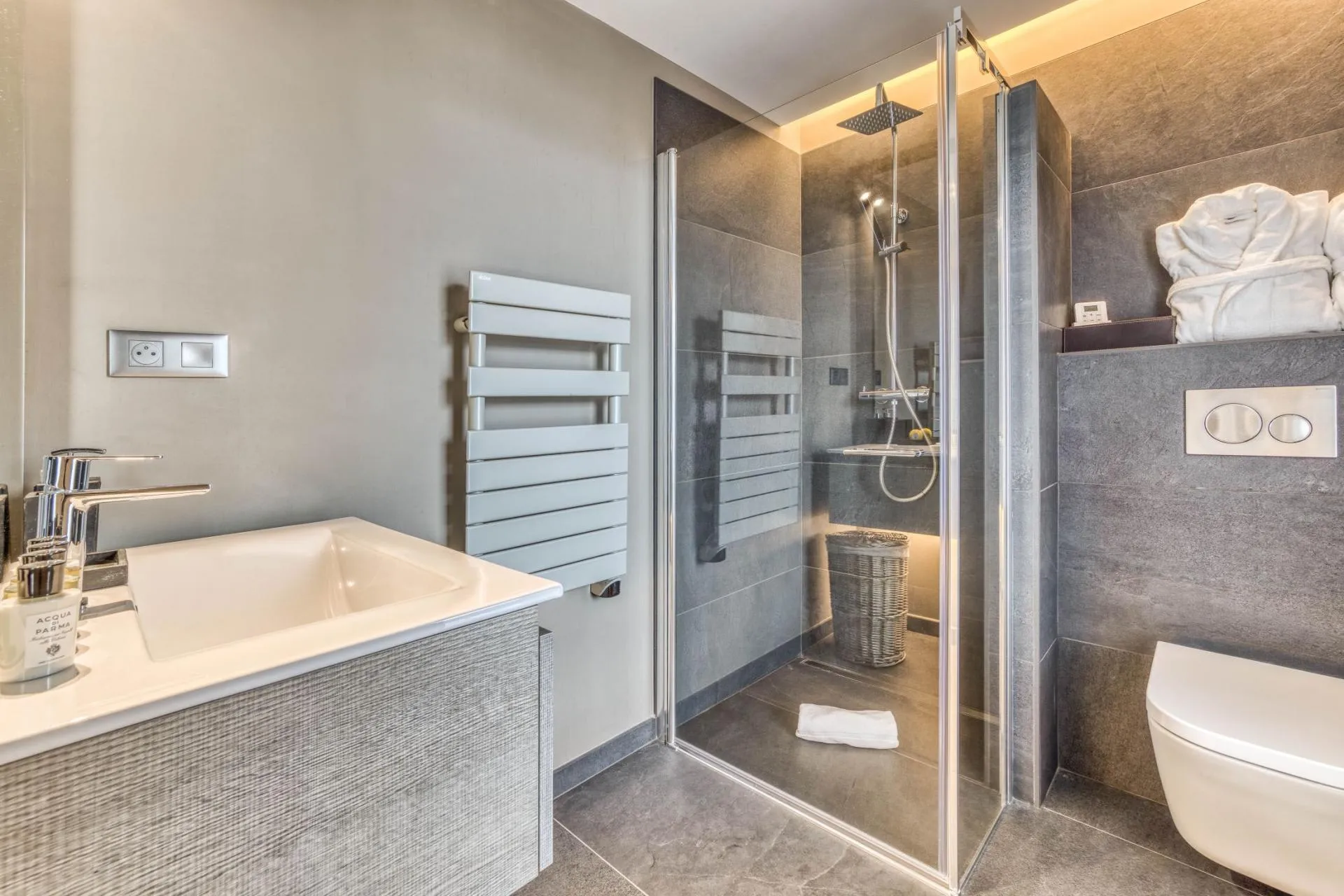 Shower room with vanity and heated towel rail