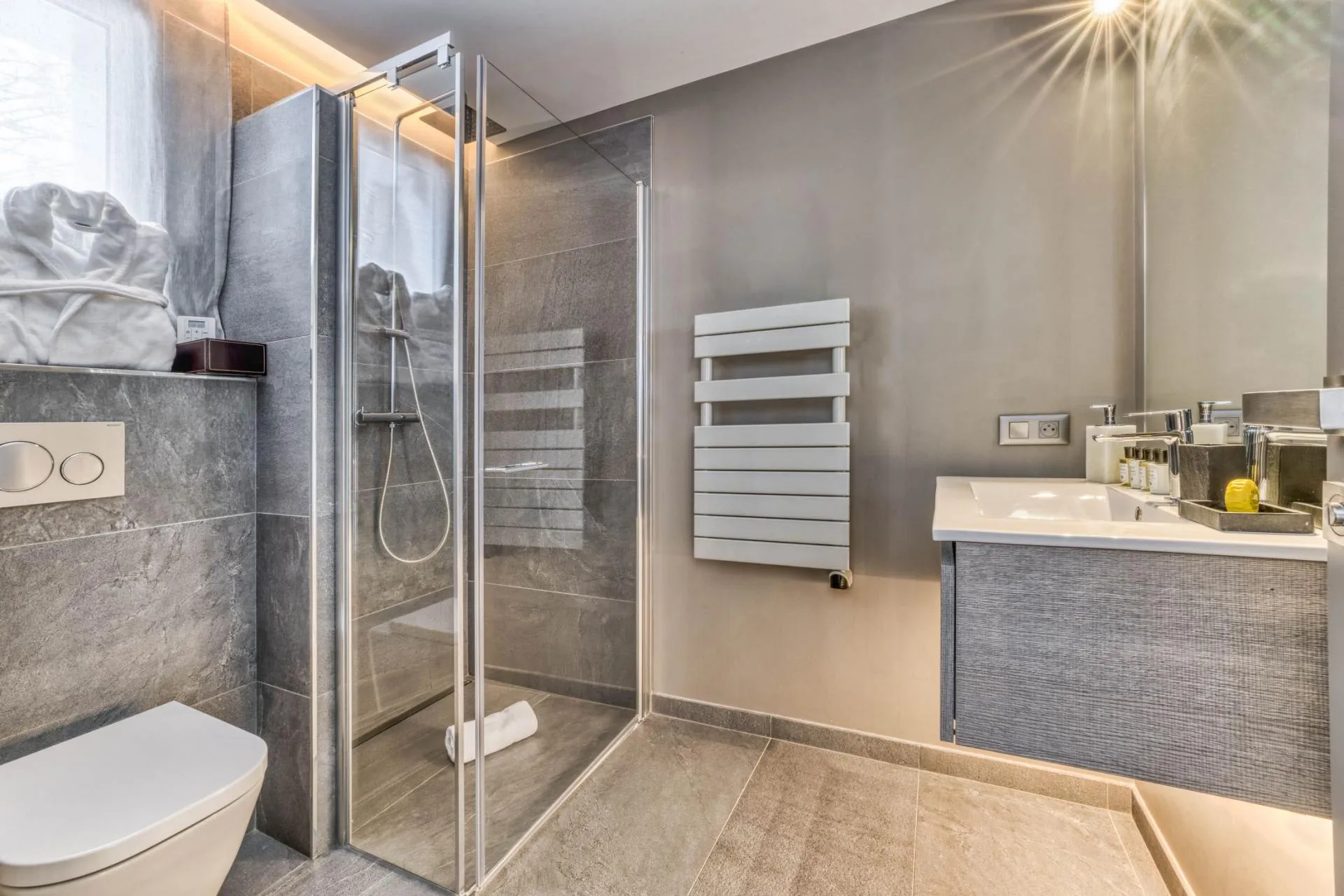 Bathroom with a glass shower and heated towel rail