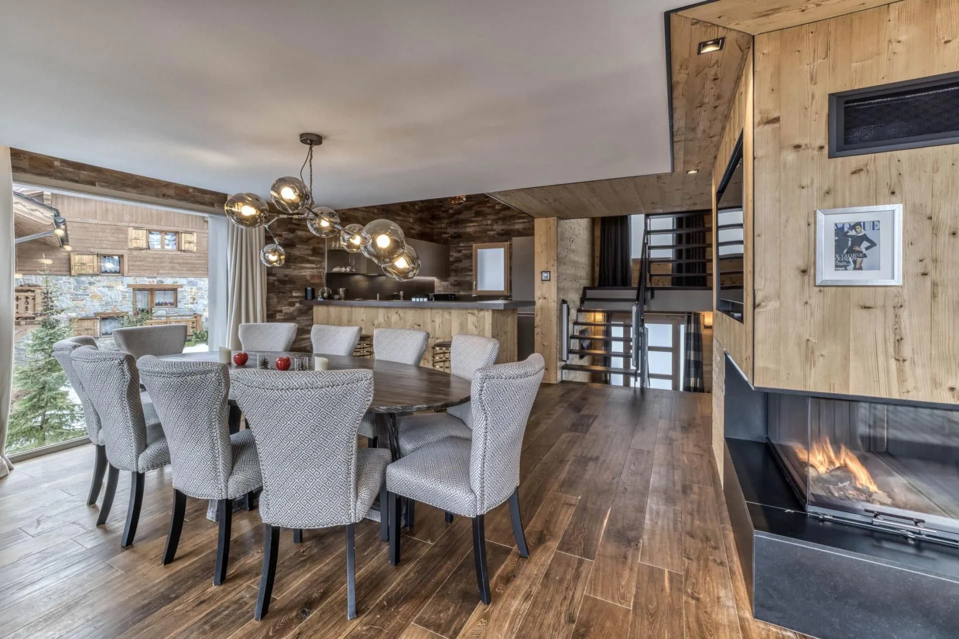 Dining area beside the fireplace and staircase