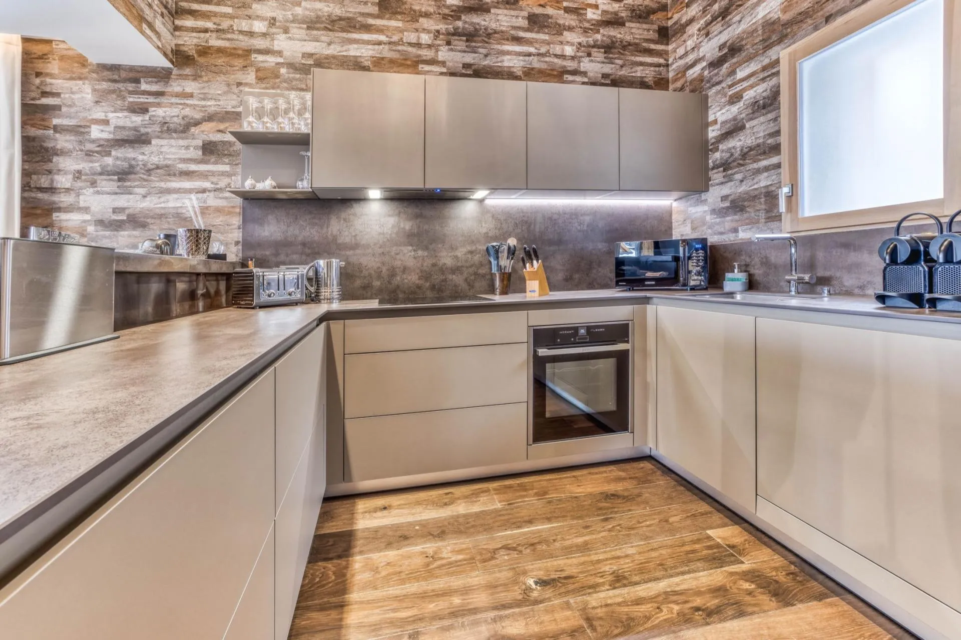 Fitted kitchen with an island and timber cabinetry