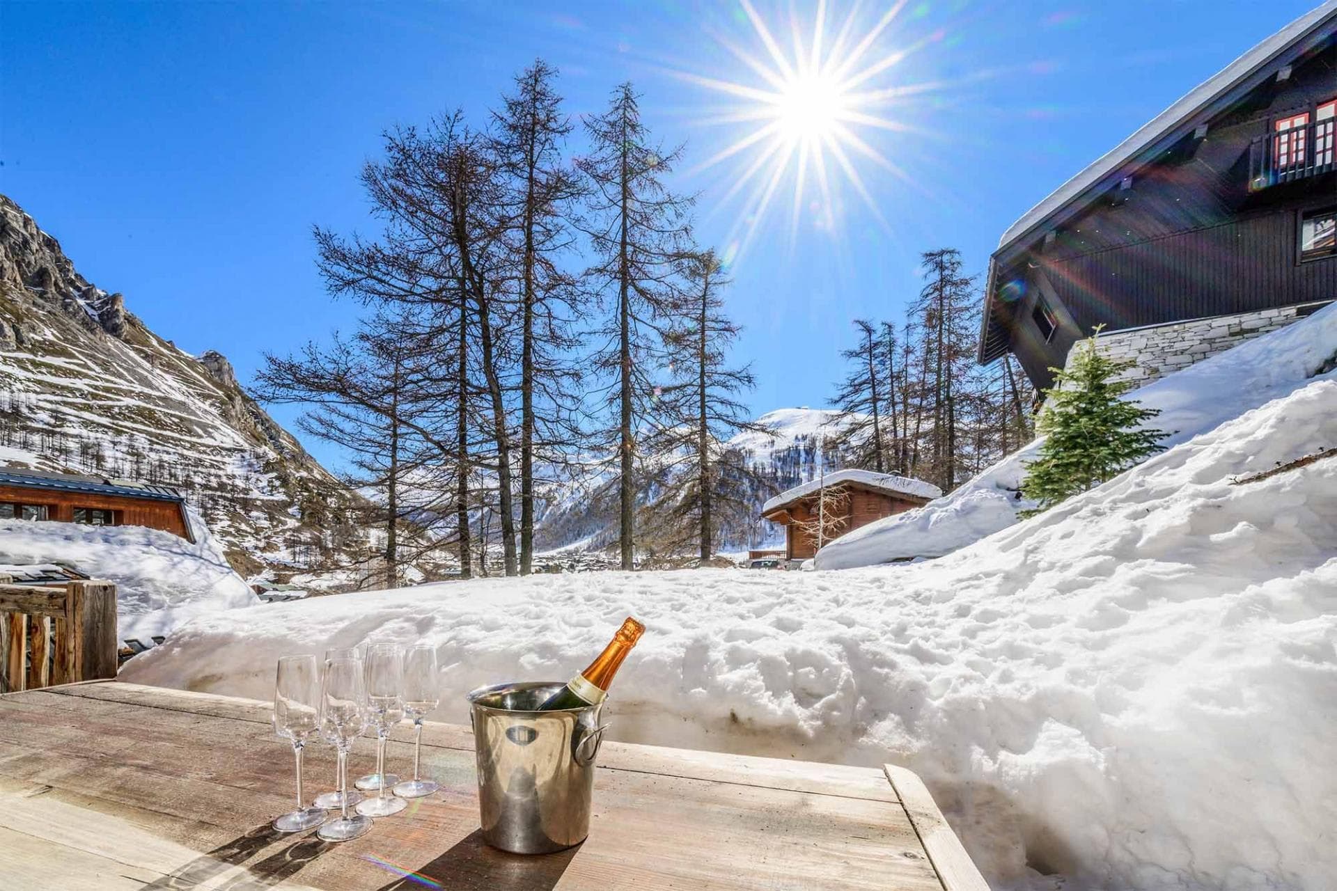 Private terrace with mountain views; outdoor dining table and champagne bucket