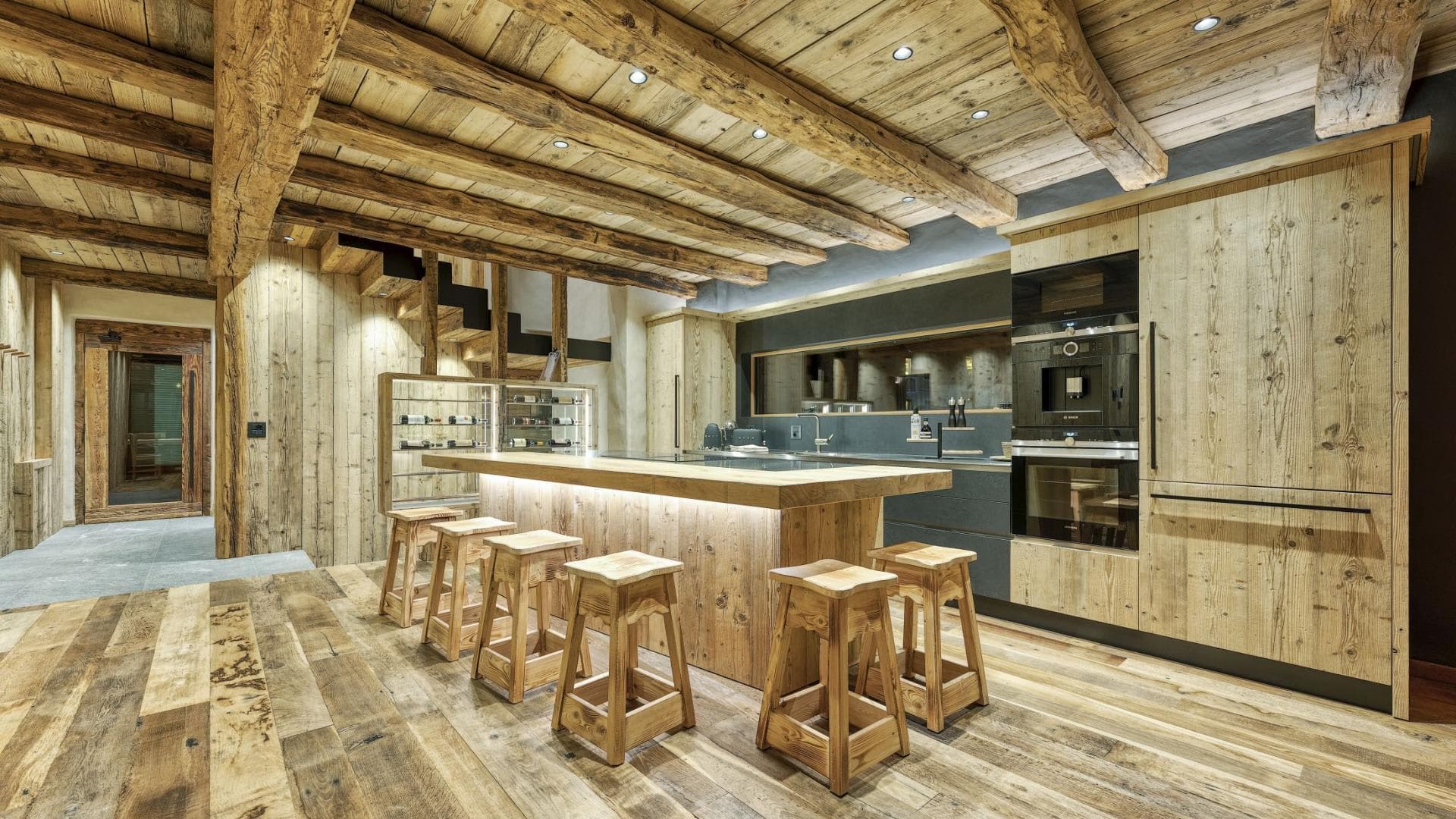 Kitchen with built-in Bosch espresso machine and breakfast bar seating for 6