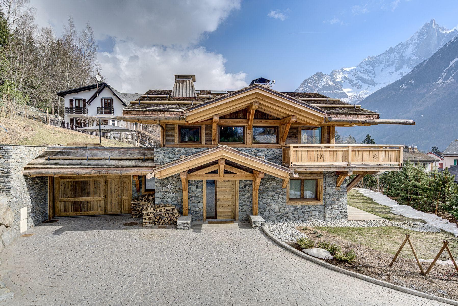 Chalet exterior with heated driveway, private garage, and Mont Blanc views