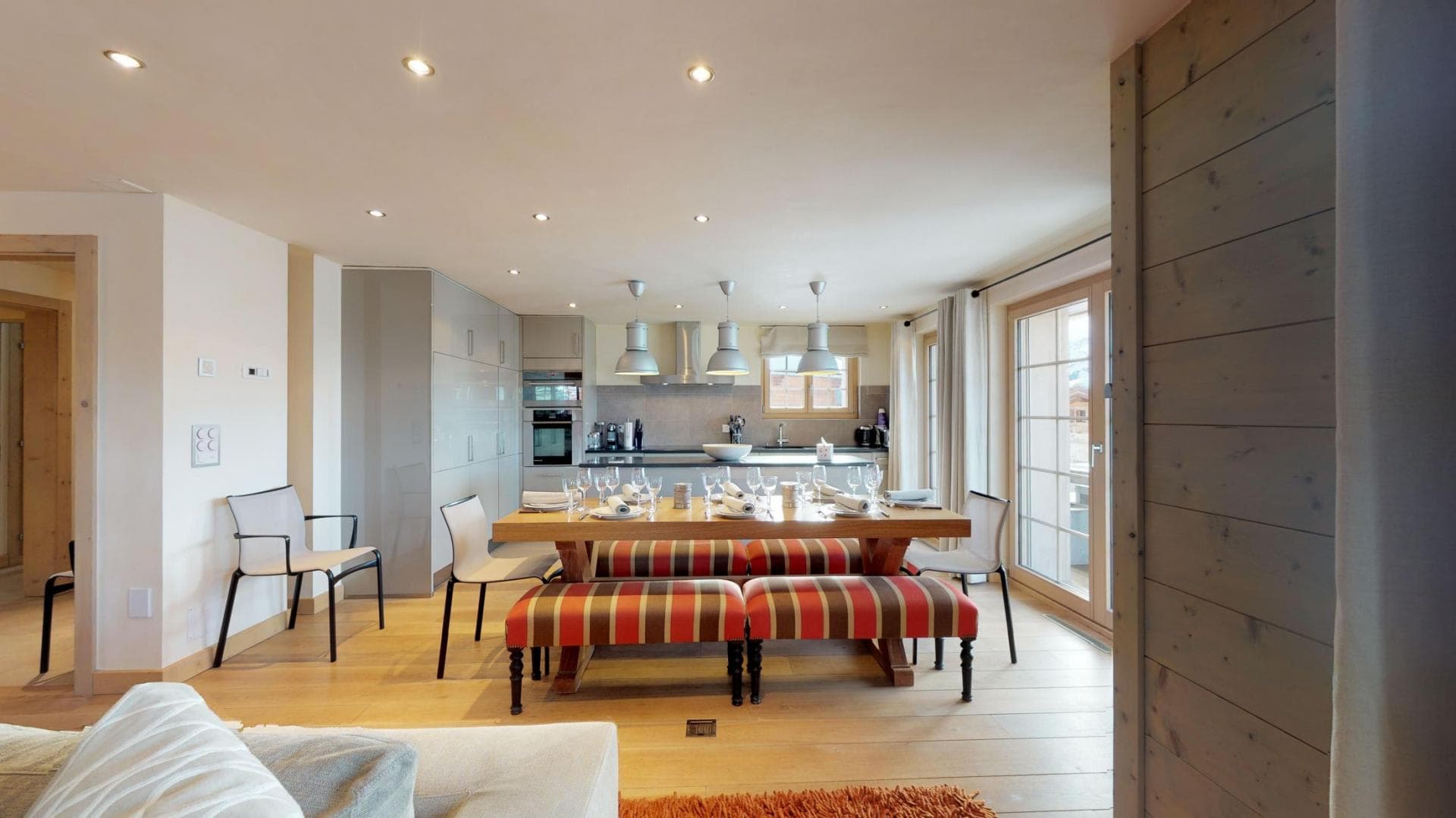 Open-plan dining area seats 10 with direct terrace access
