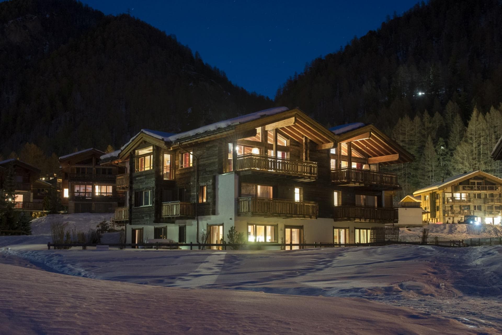 Ski-in/ski-out chalet exterior with private balconies and mountain views