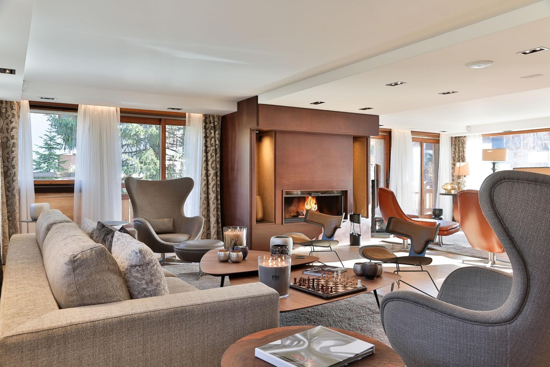 Living area with wood-burning fireplace and seating for 10 guests