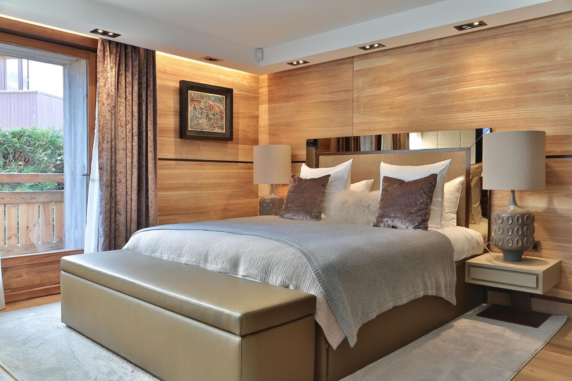 Primary bedroom with king bed and direct balcony access