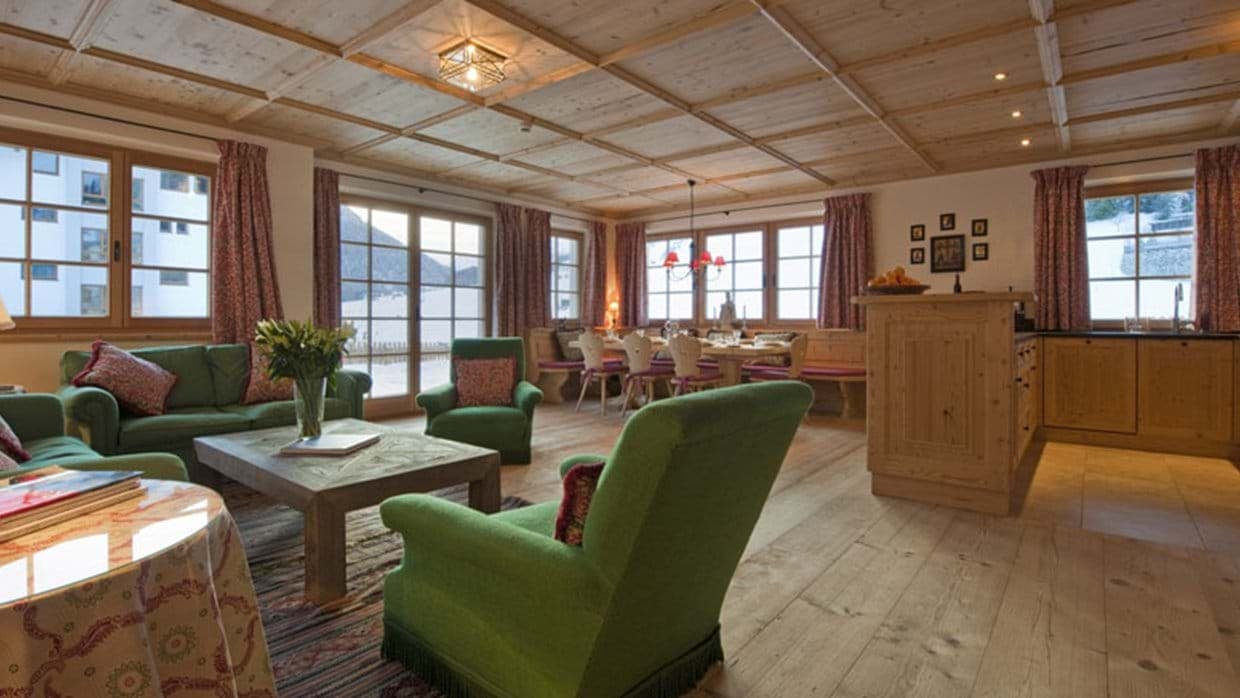Open-plan living area with coffered wood ceiling and breakfast bar