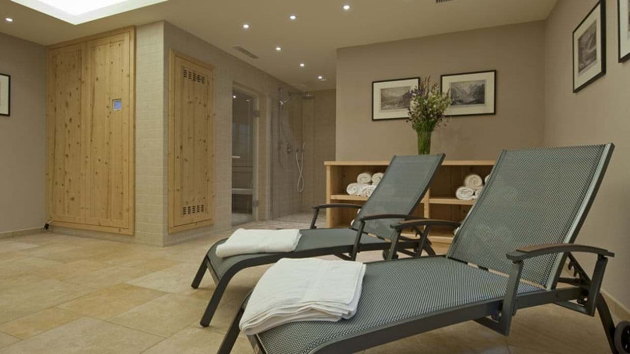 Private spa area with wooden sauna and walk-in shower