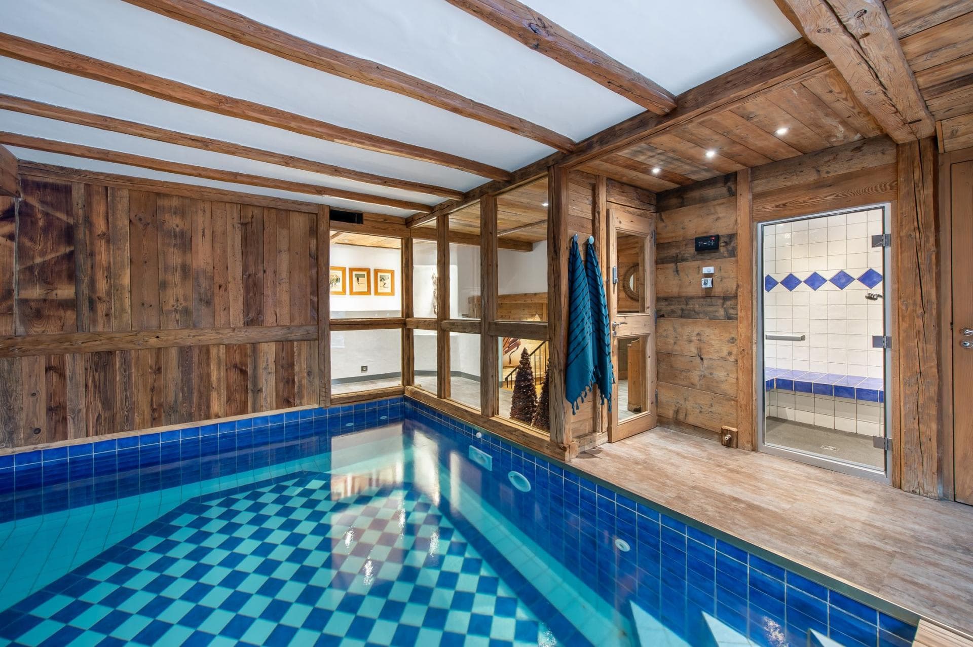 Indoor pool and steam room with original timber beams
