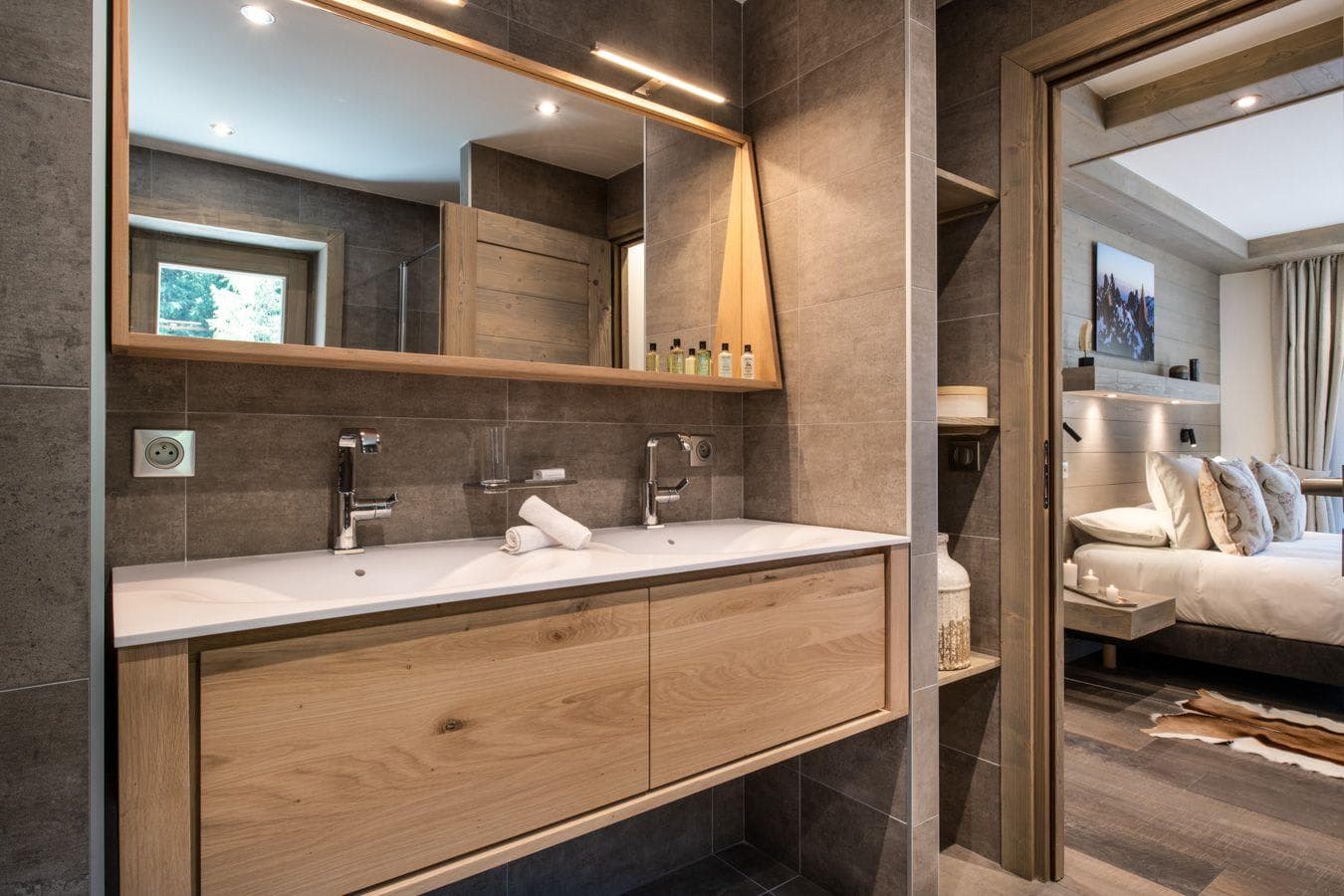 Primary en suite with double vanity and integrated mirror lighting