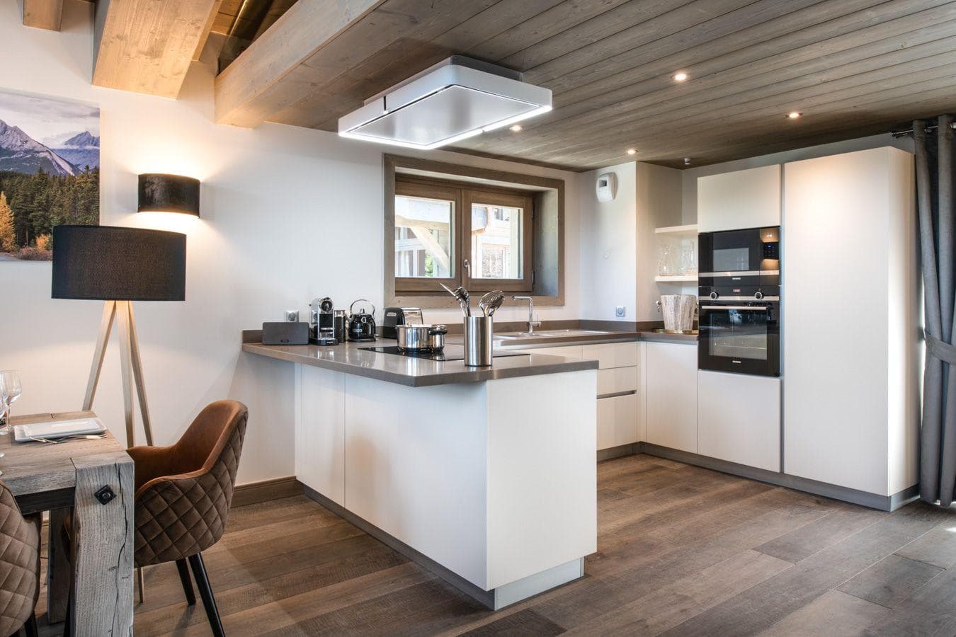 Kitchen with induction cooktop and integrated double oven