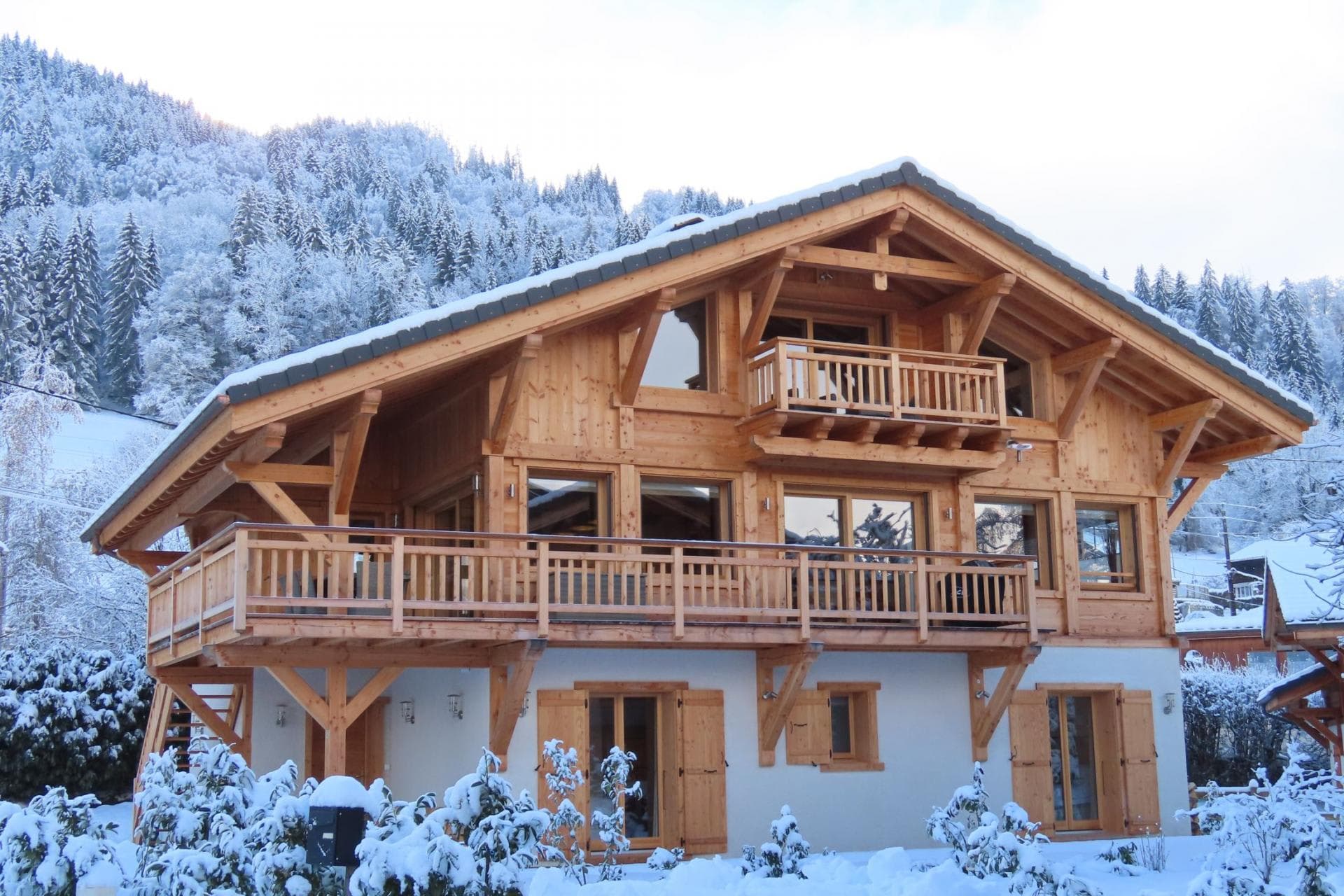 Ski chalet exterior with wrap-around balcony and private bedroom terrace