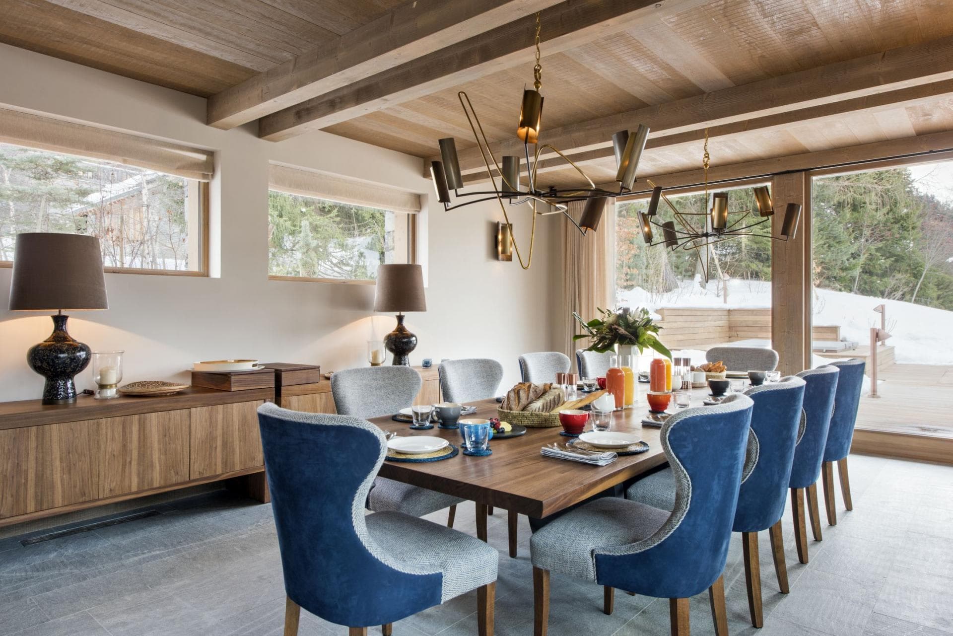 Dining area with seating for 10 and snowy forest views