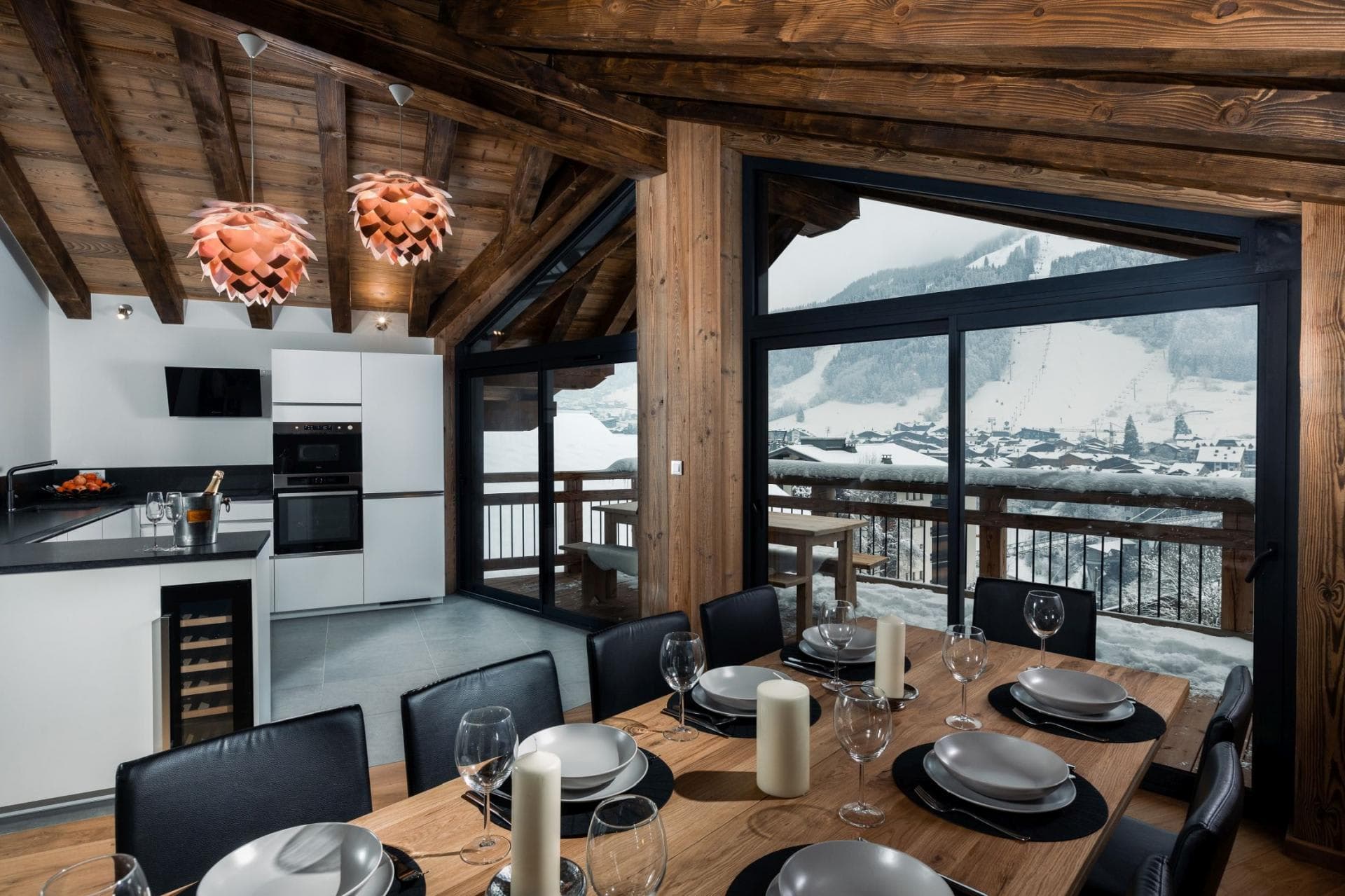 Dining table seats 8; kitchen with wine fridge and ski views