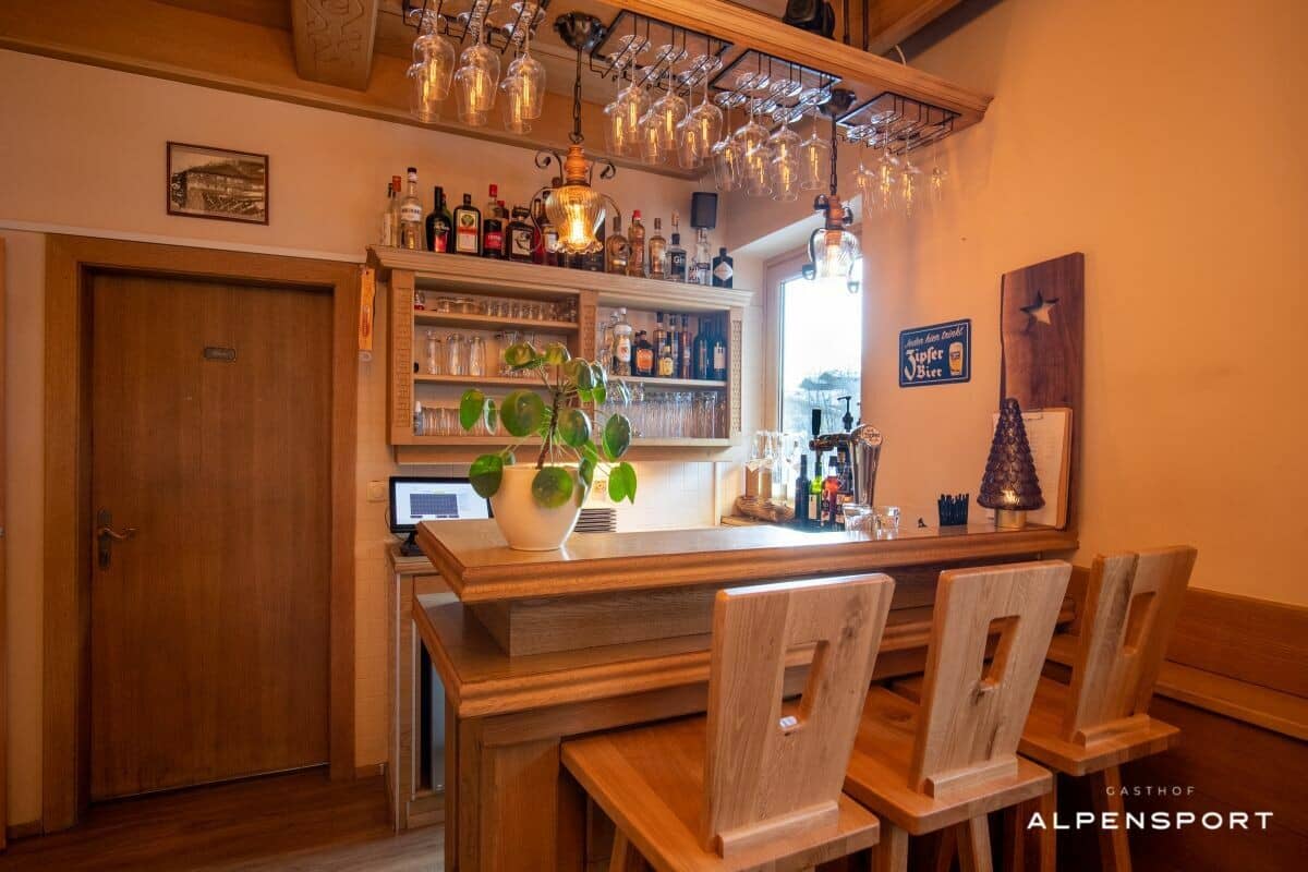 Private bar area with wood seating and draft beer tap