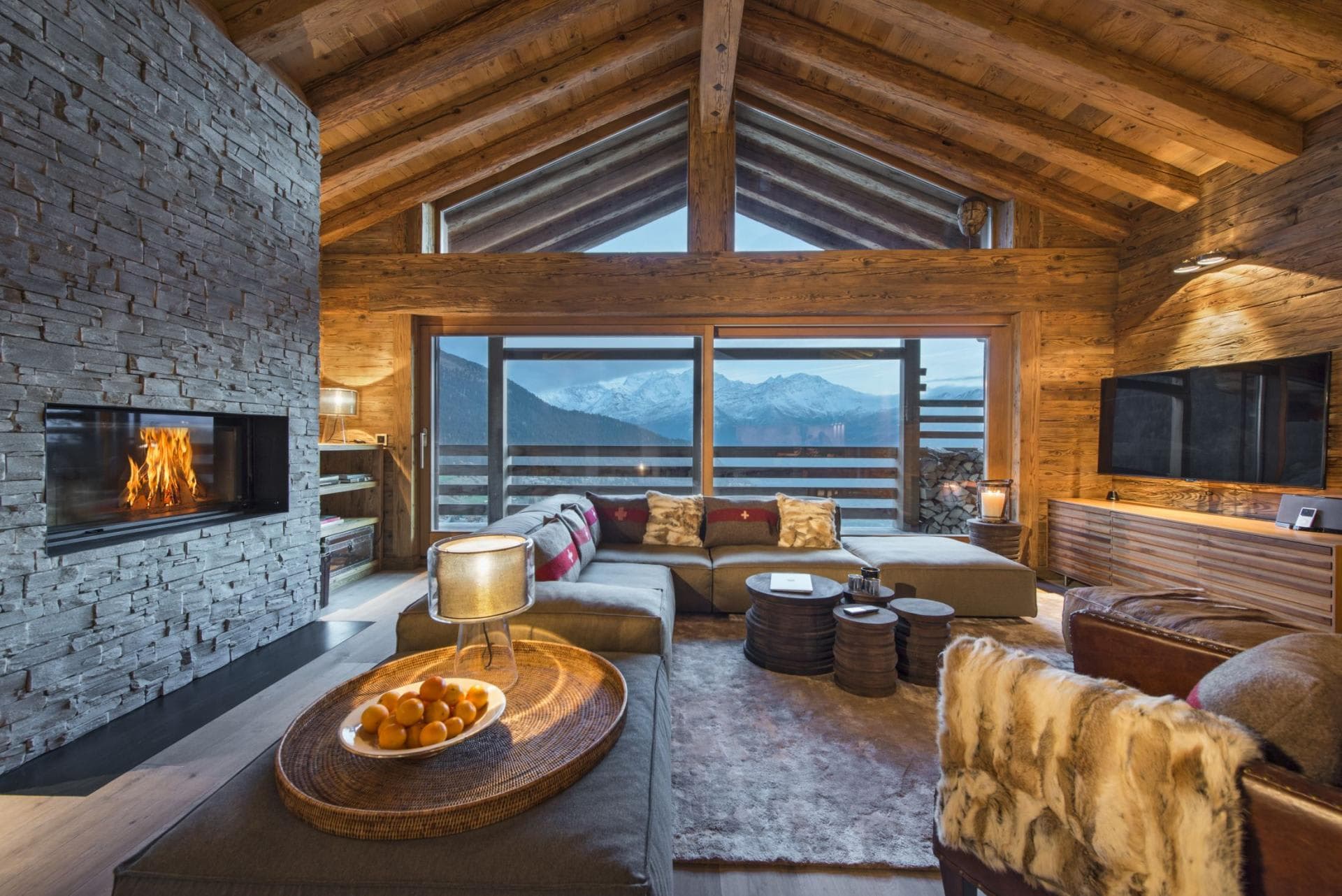 Living area with wood-burning fireplace and panoramic mountain views