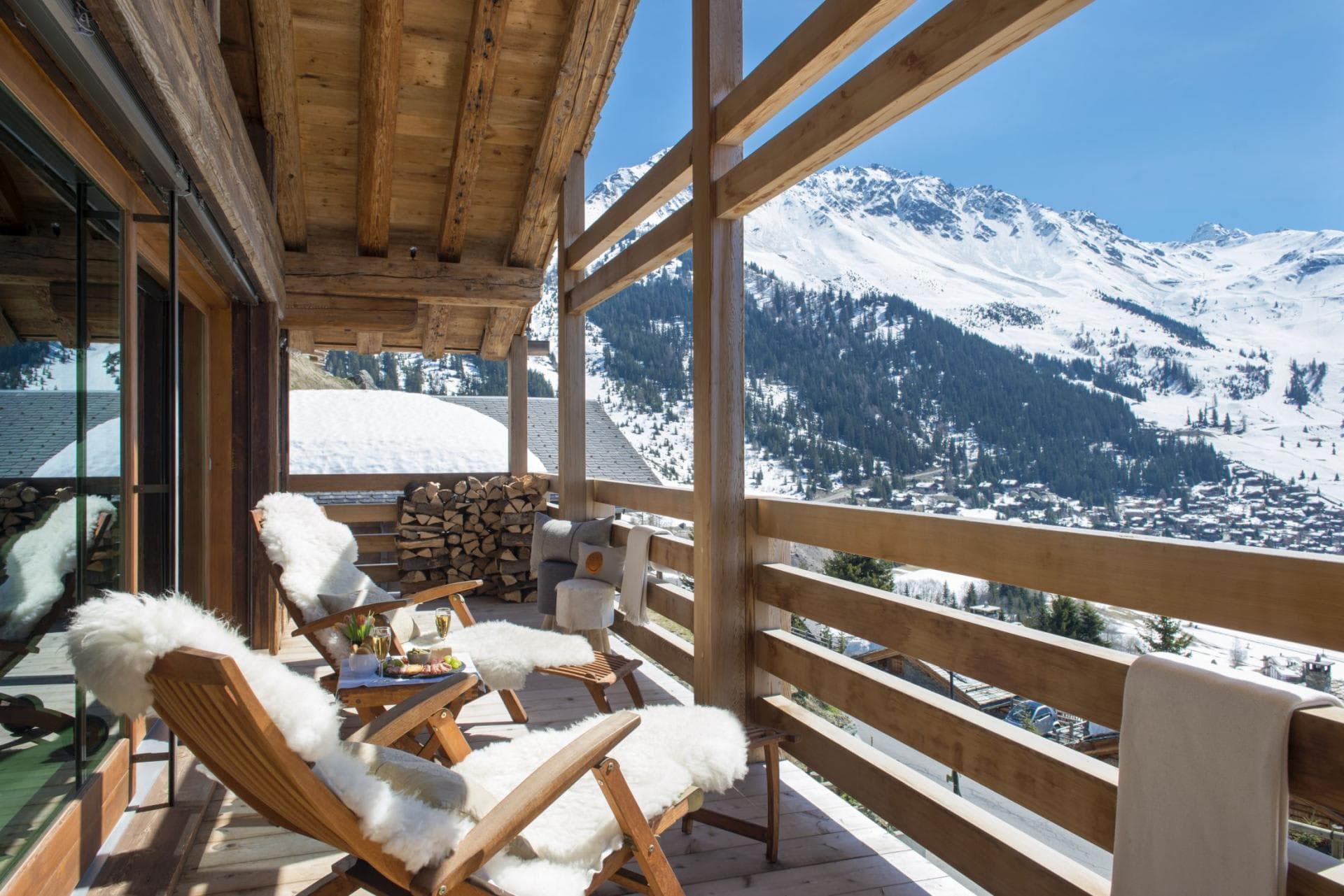 Private balcony with lounge seating and panoramic alpine views