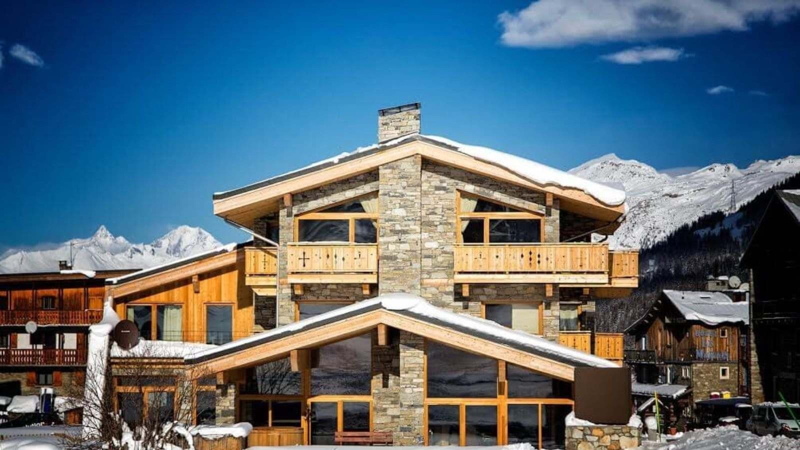 Stone and timber chalet with private balconies and mountain views