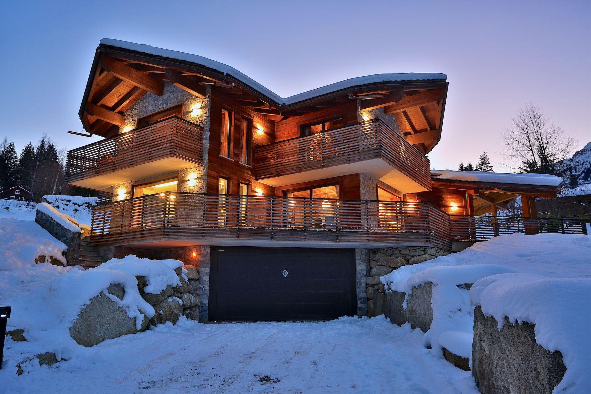 Chalet exterior with two-car heated garage and wraparound balconies