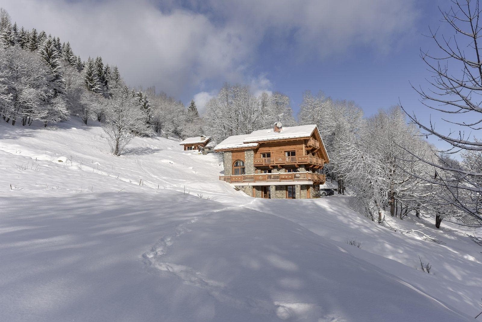 Ski-in, ski-out timber chalet with wrap-around balconies and mountain views