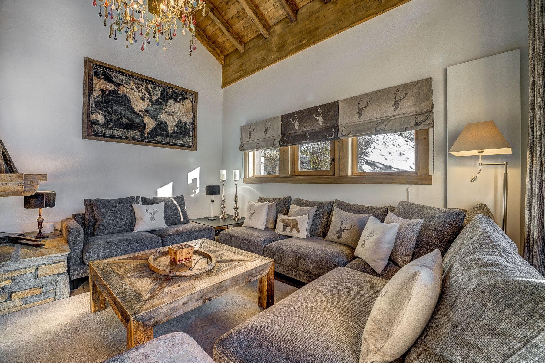 Living area with sectional seating and vaulted timber ceilings