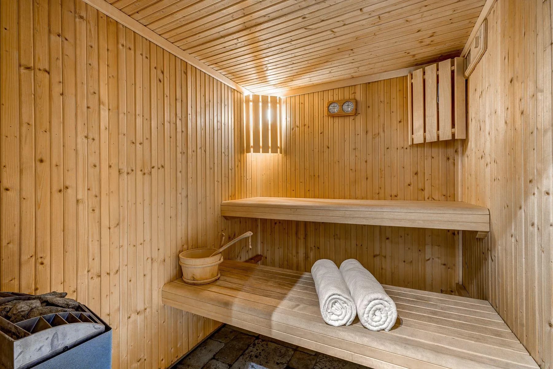 Private sauna with two-tier timber bench seating