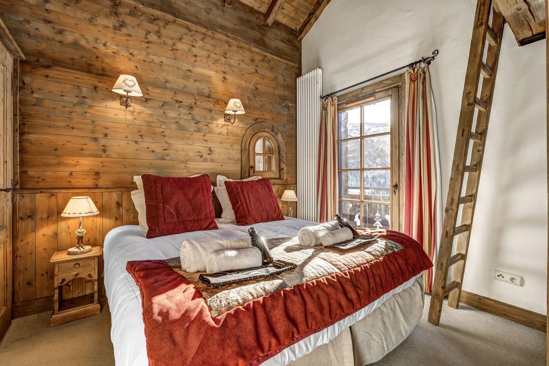 Guest bedroom with a king bed and timber-clad interior