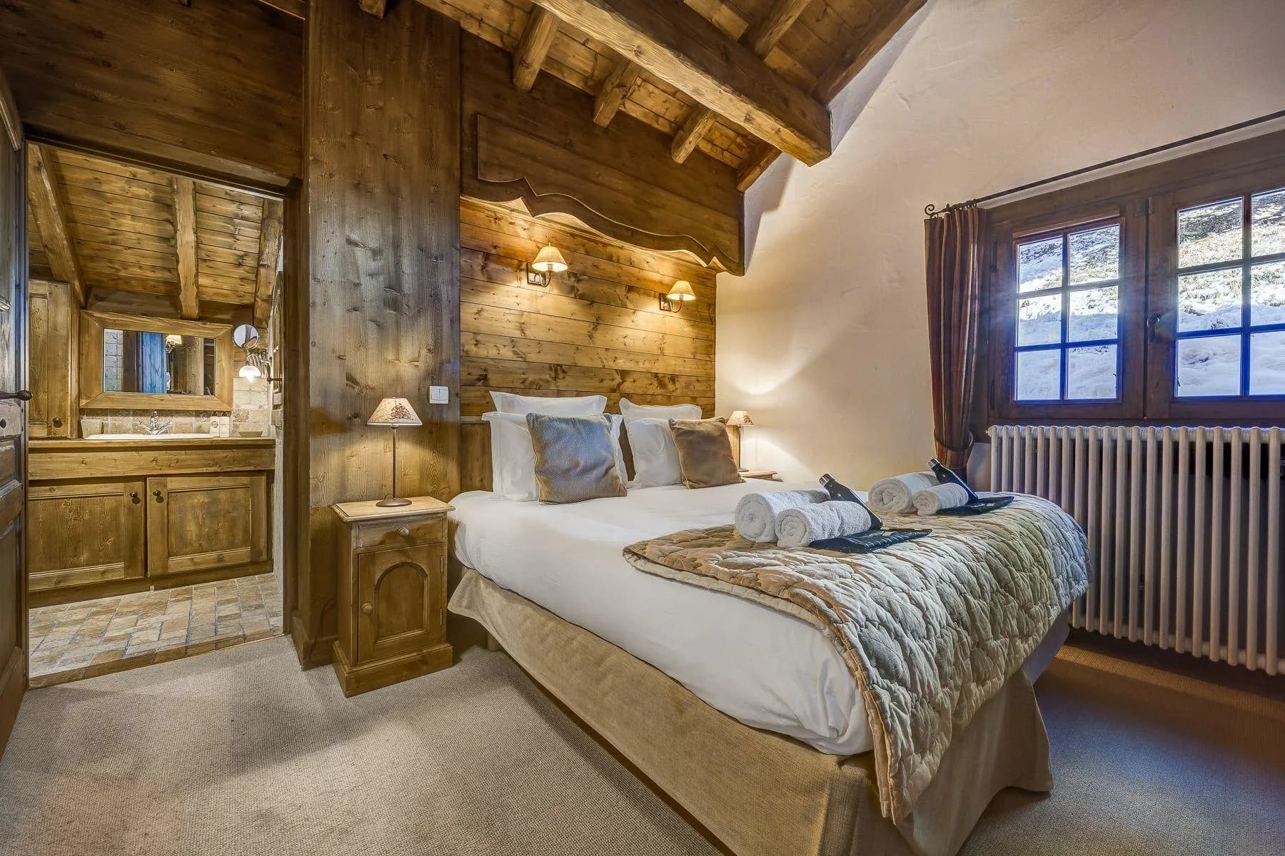 En-suite guest bedroom with timber-clad walls
